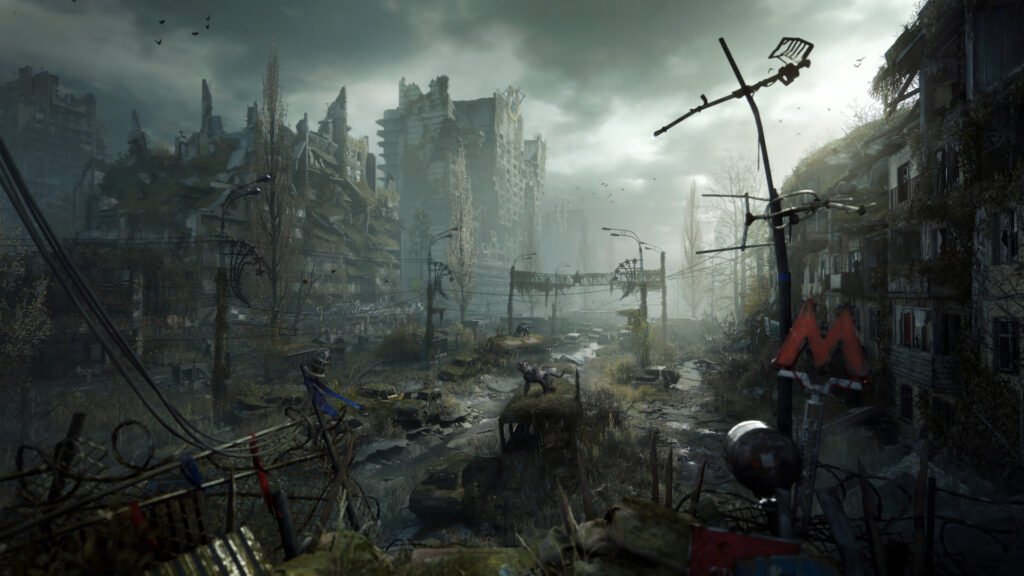 Desolate ruined city street with crumbling buildings, overgrown vegetation, and abandoned vehicles, viewed from a barbed-wire fence.