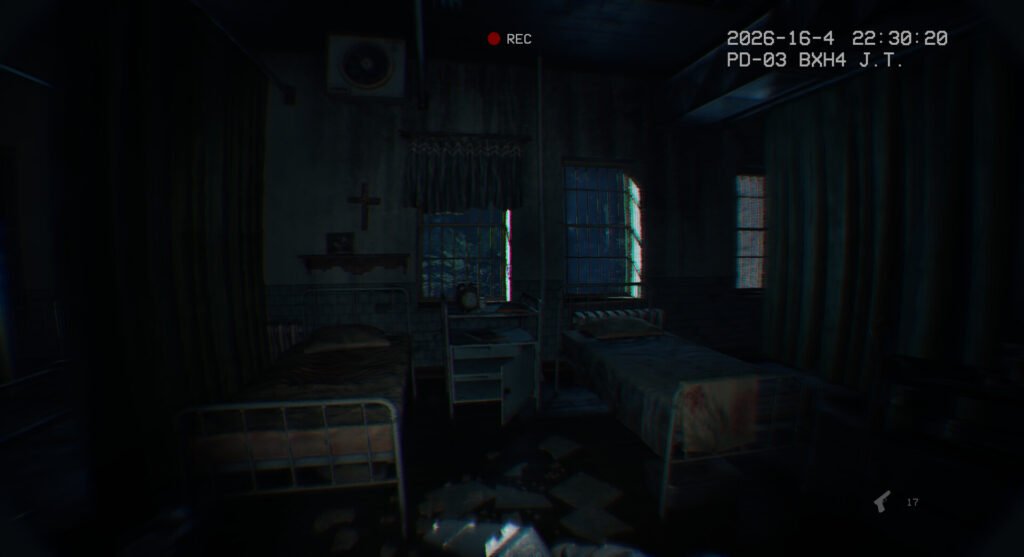Dim hospital ward with two metal beds, a cross on the wall, and a red REC indicator at top center.