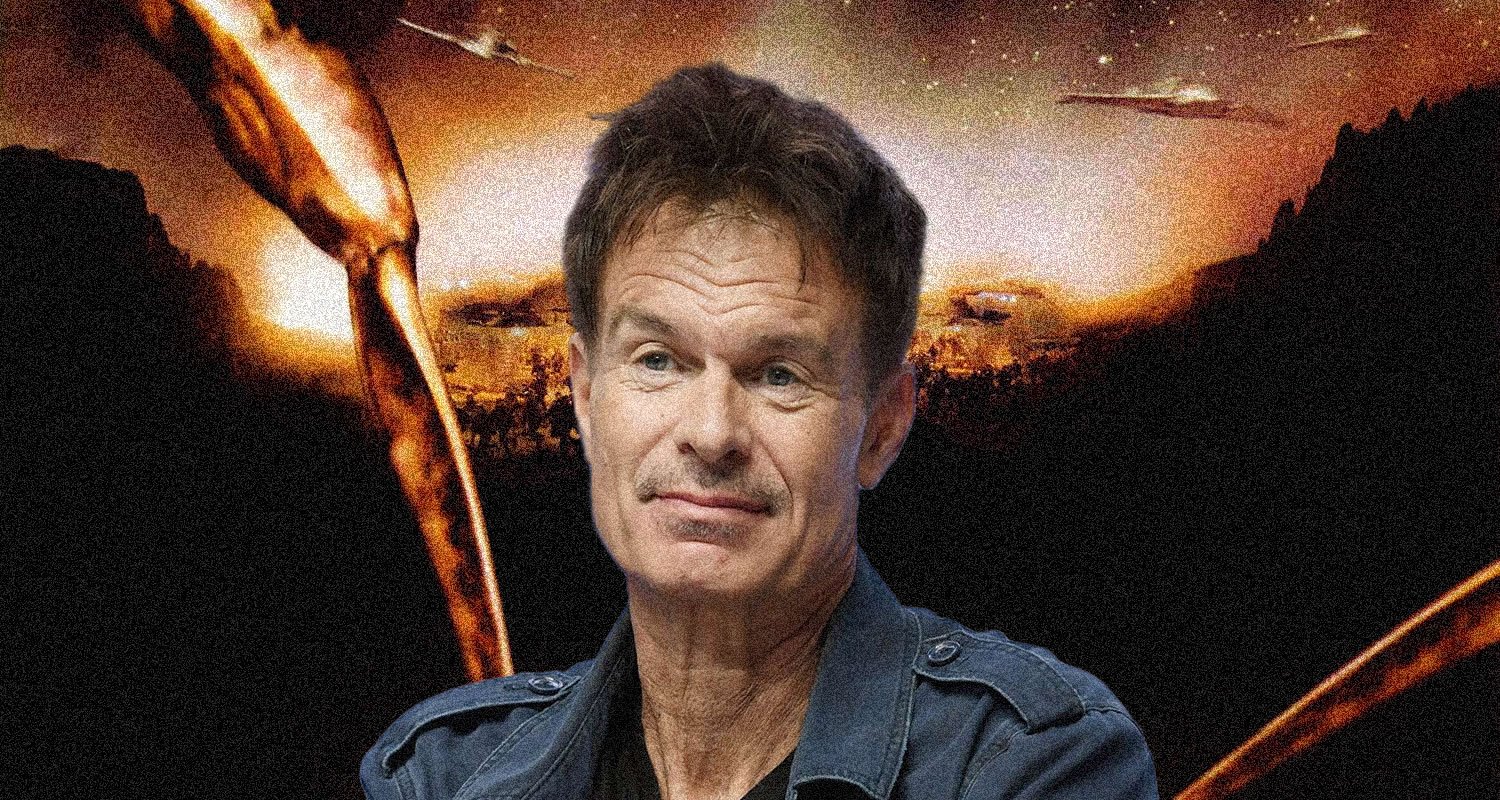 Middle-aged man in a denim jacket against a fiery, apocalyptic landscape with explosions in the background.