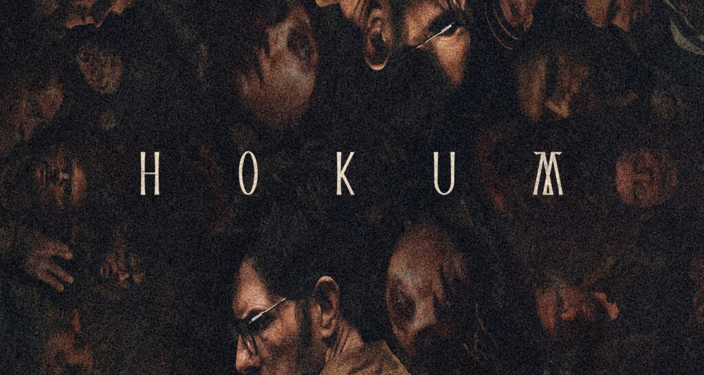 Dark crowd scene with the word HOKUM spelled out in large spaced letters across the middle of the image.