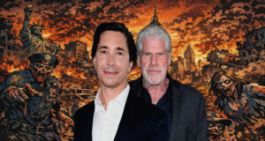 Two men in suits posing in front of a dramatic zombie-apocalypse cityscape with flames and ruined buildings behind them.