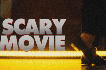 Poster-style image with large gray text 'SCARY MOVIE' across the left, a grainy, yellow-lit background, and a silhouetted figure on the right.