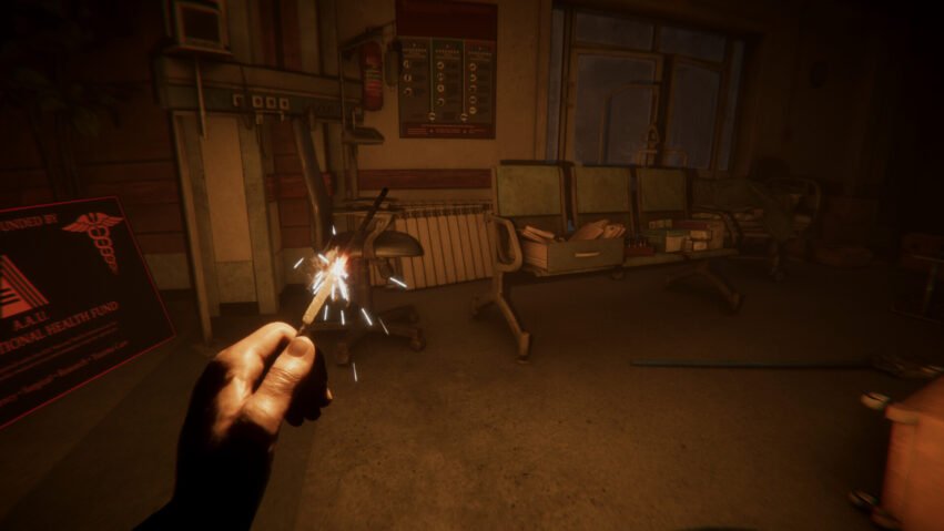 First-person view of a hand holding a lit sparkler in a dim, abandoned hospital ward with old chairs and medical equipment in the background.