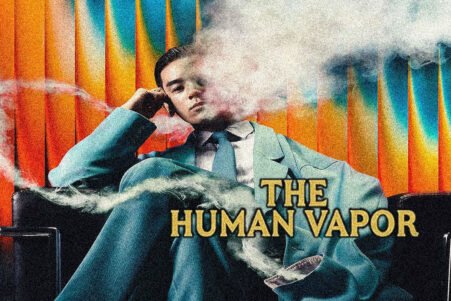 Man in a teal suit lounging in a chair, vapor obscuring his face; bold title 'THE HUMAN VAPOR' across the image.