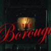 Poster artwork for The Boroughs, with bold red cursive text over a dim, vintage TV in a dark setting.