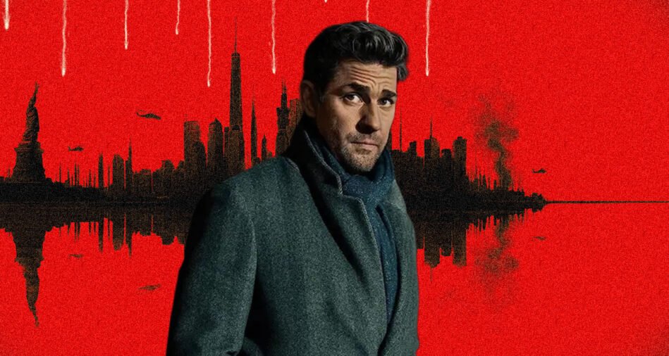 Man in a dark gray overcoat and scarf poses in front of a red skyline with a black water-reflection scene behind him.