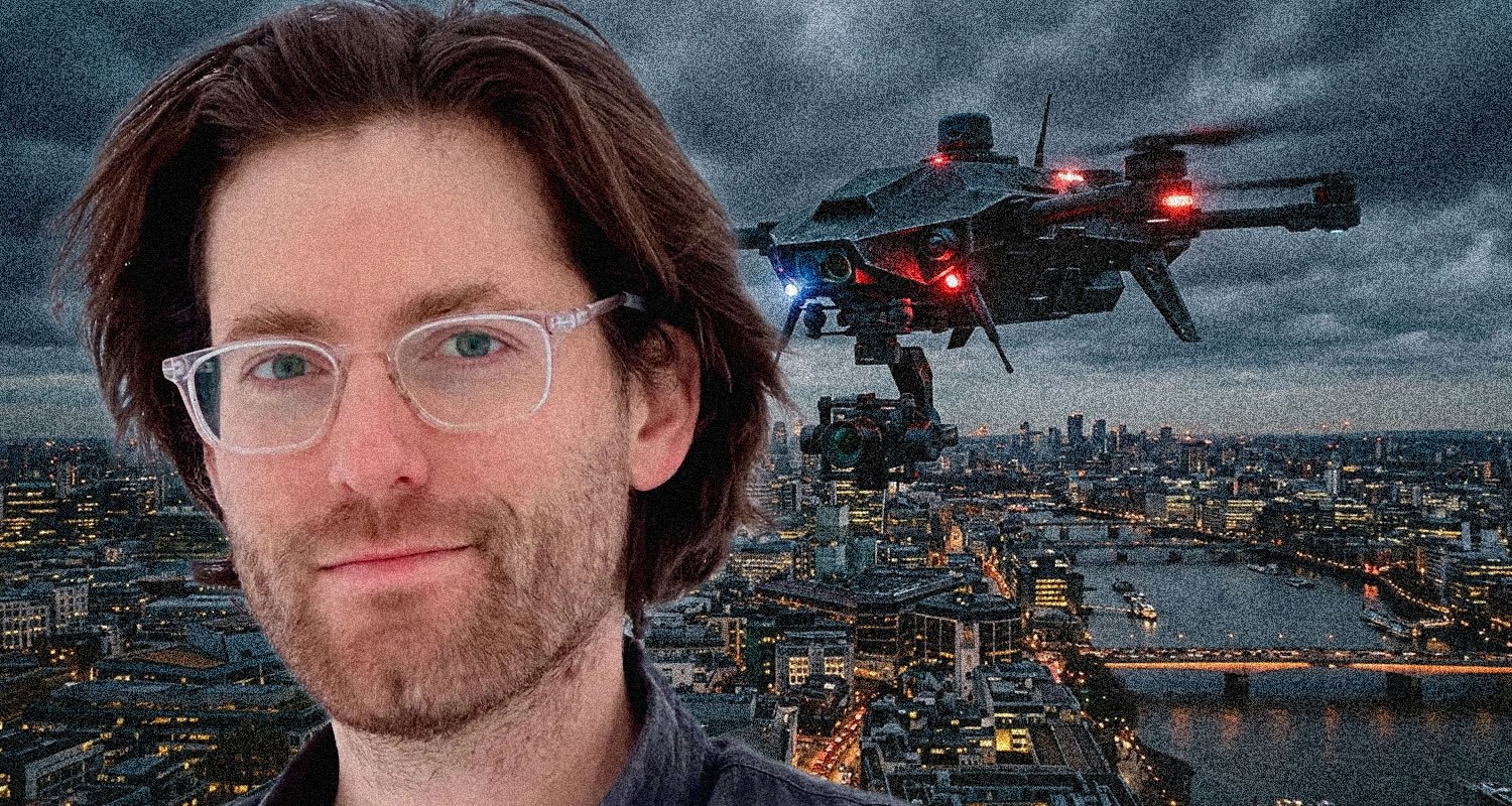 Man with clear glasses in the foreground; a drone hovering above a city skyline at dusk.