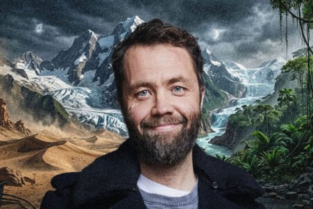 Smiling man with a beard in front of a surreal collage of desert dunes, snow-capped mountains, and a tropical jungle.
