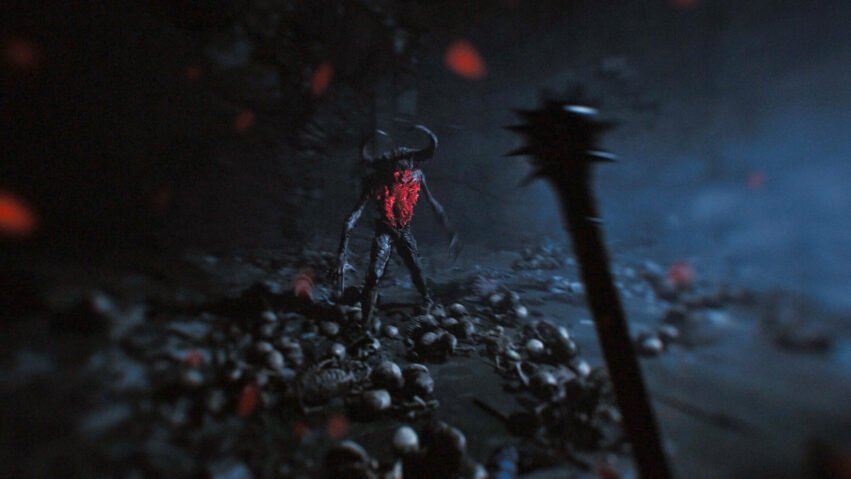Dark cavern scene with a horned demon standing among a pile of skulls, illuminated by red glow from its chest? area glow in blue-tinted fog.