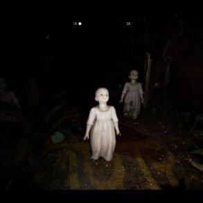 Dark outdoor scene with three eerie porcelain dolls in white dresses; haunted atmosphere in a dim yard, with a video camera HUD overlay.