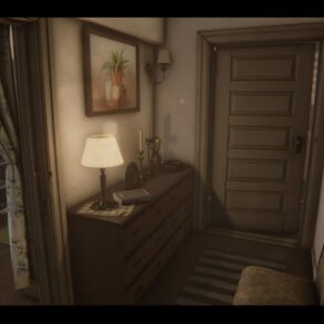 Cozy hallway with a dresser, lamp, and framed paintings along the walls. A striped rug runs beside it, and a closed paneled door is at the end.