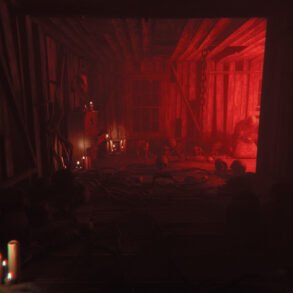 Red-lit attic scene with scattered bones, skulls, and candles around a ritual space, casting eerie shadows on wooden beams and a windowed wall.