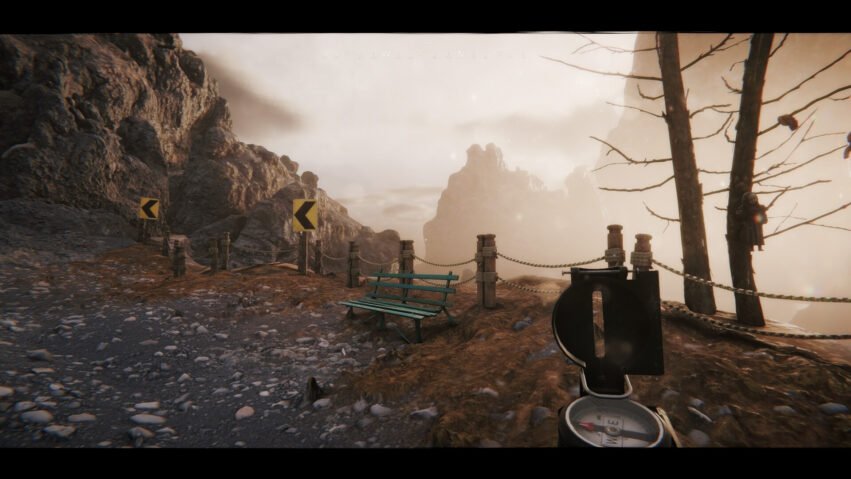 Rugged mountain path with rocky cliff on the left, yellow chevron signs, rope railing, and a green bench along a misty overlook.