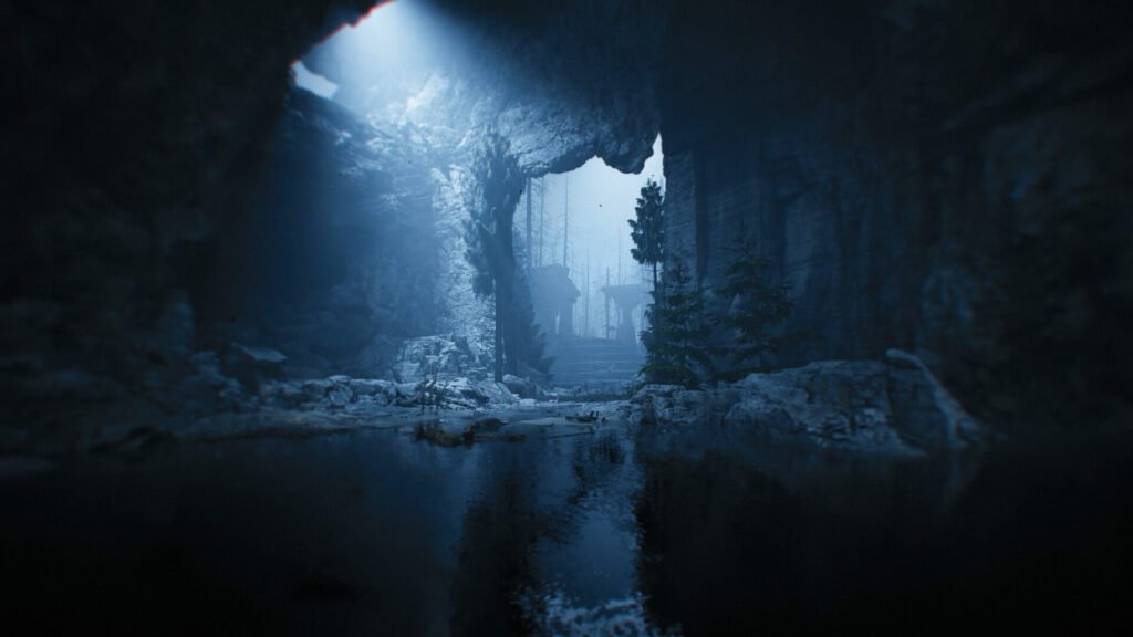 Dark cave interior with a blue glow filtering through an opening; rocky walls, a shallow pool, and distant trees beyond a stairway.