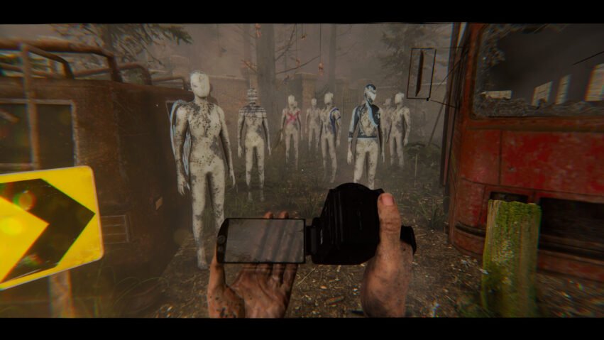 First-person view of a player holding a pistol toward a line of pale zombie-like figures in a ruined industrial yard.