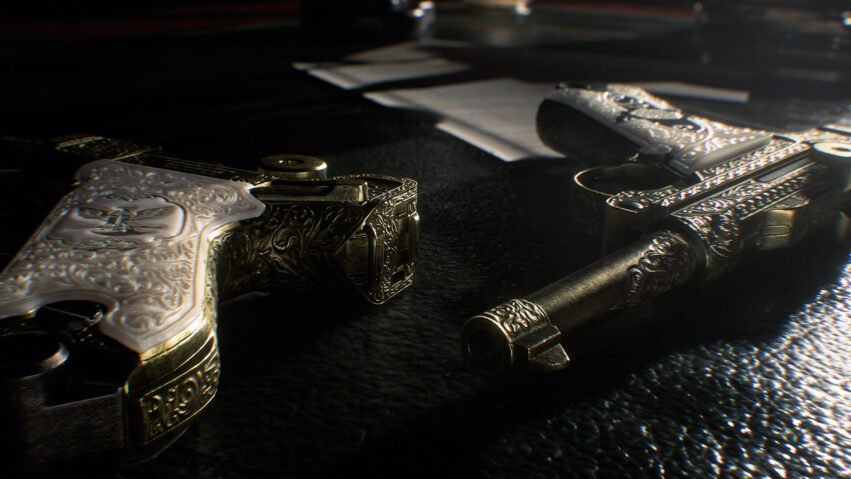 Close-up of ornate engraved pistols with silver and mother-of-pearl grips on a dark surface.