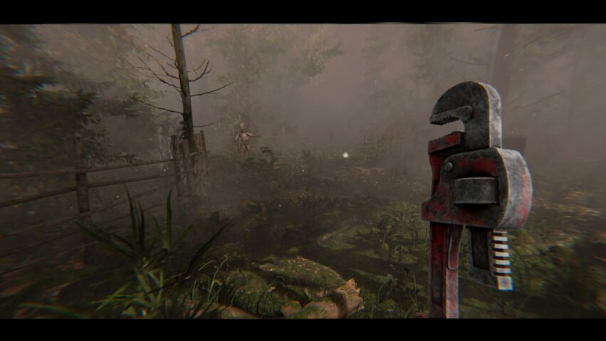 Foggy forest scene with a large rusted industrial tool in the foreground; a pale, childlike figure stands near a fence in the distance.