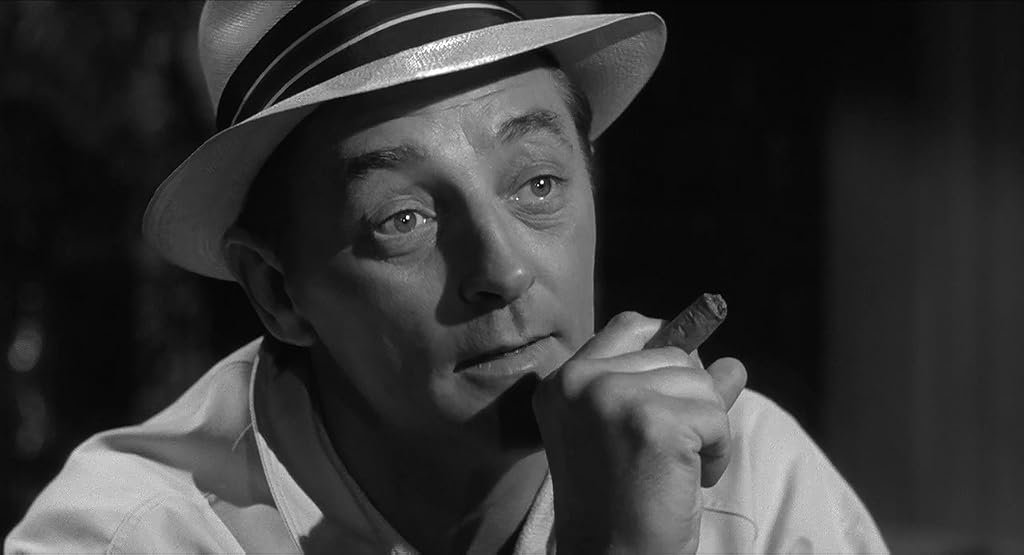 Robert Mitchum dans Les nerfs à vif (1962)
